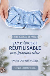 Un sac de courses pliable avec fermeture éclair, en tissu coloré, sur un fond de table festive.