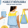 Sac à dos pliable fait maison en tissu coloré sur une table.